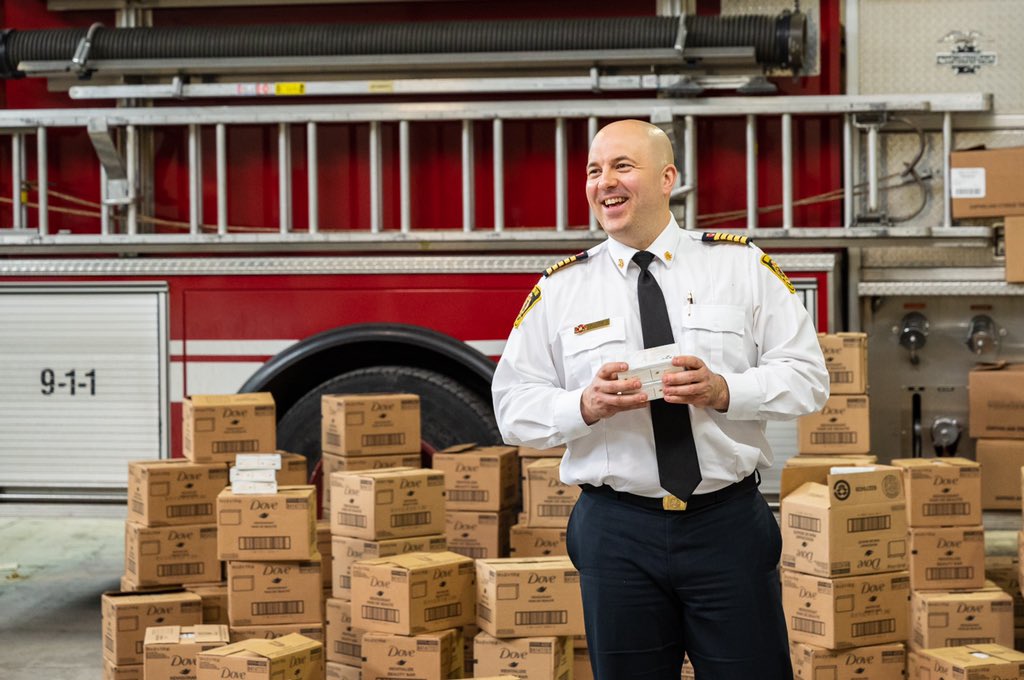 Fire martial with donations of dove soap, helping the community