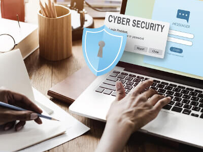 Student studying cyber security on a laptop